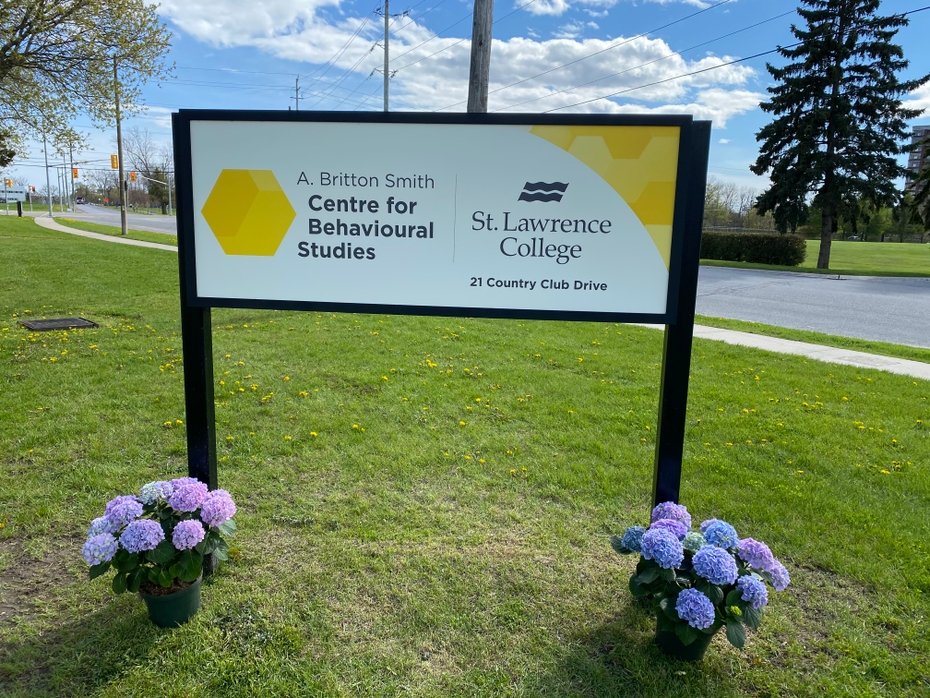 The sign for the A. Britton Smith Centre for Behavioural Studies is shown on green grass on the Kingston campus.